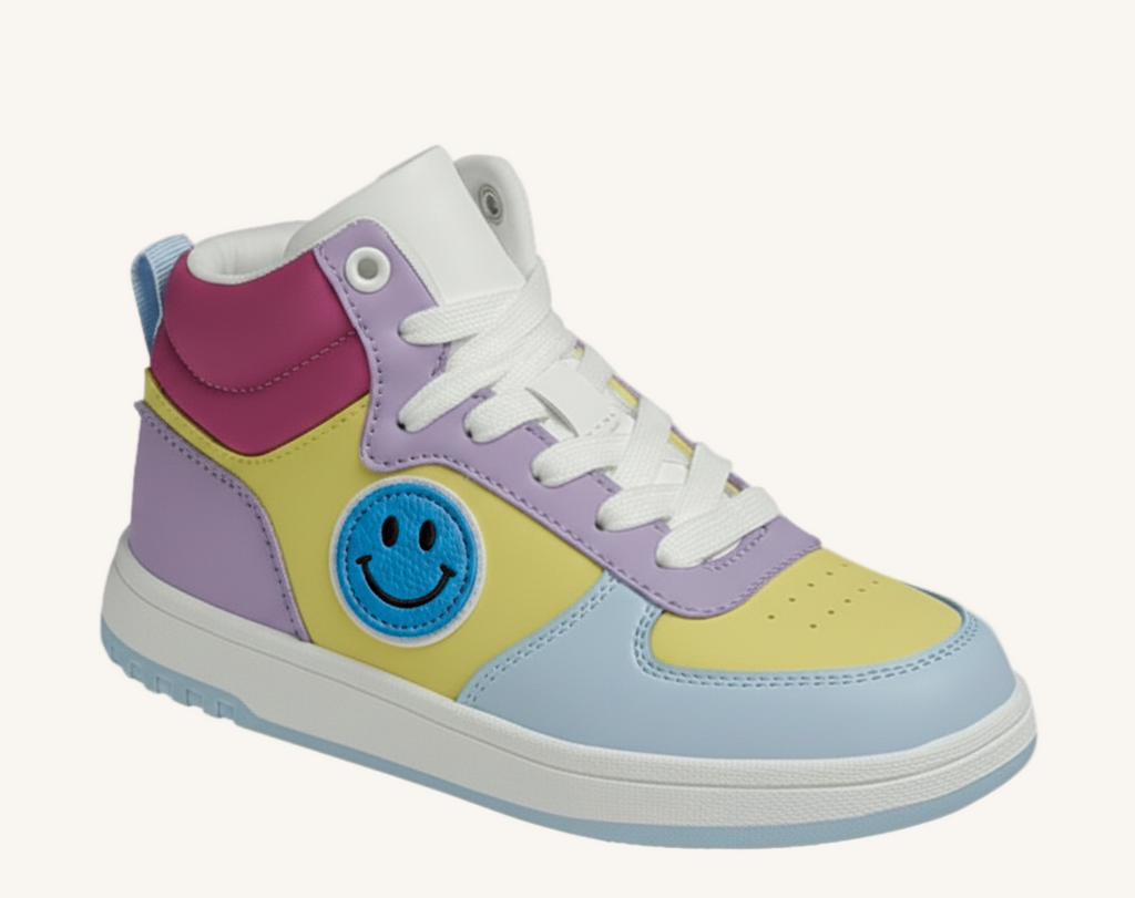 Colorful sneaker with a smiley face patch on a white background